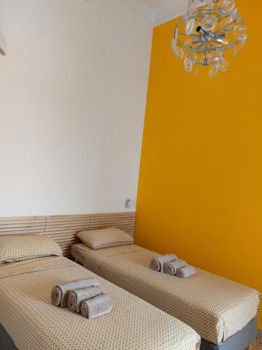 two beds sitting next to each other in a room at Suite La TERRAZZA ILLUMINATA in Trapani