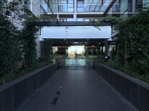 an empty hallway in a building with plants at Doncaster Lux 3b2b Apt Balconyparking in Doncaster