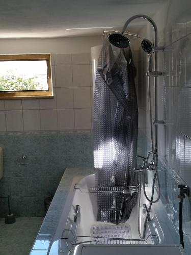 a kitchen with a strainer on top of a sink at Holiday Home Casa Matilde in Koromačno