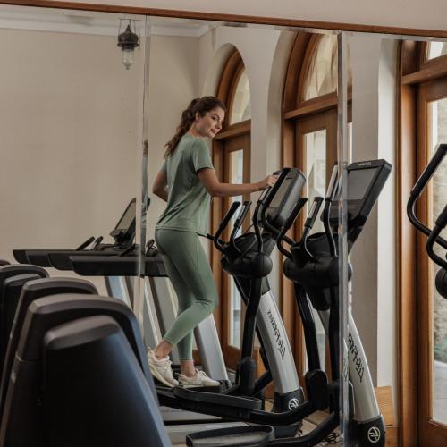 a woman on a treadmill in a gym at The Oberoi Beach Resort, Sahl Hasheesh in Hurghada