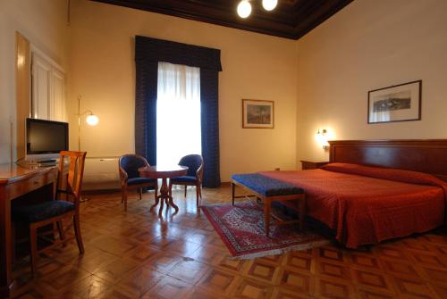 เตียงในห้องที่ Hotel Palace Bologna Centro