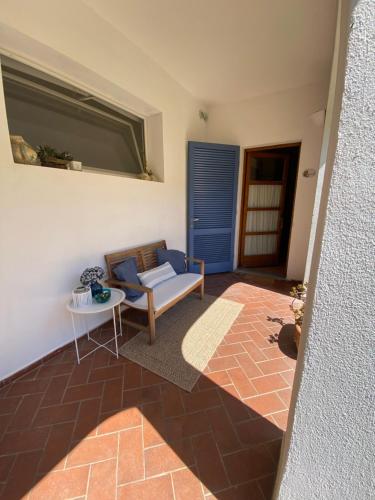 a living room with a couch and a table at Valle dei Mulini B&B in Marciana