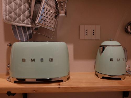 two toasters sitting on top of a wooden counter at Casa Melox in Lezzeno