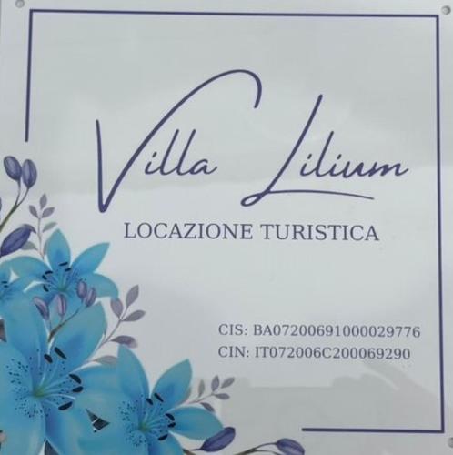 a sign for a hotel with blue flowers at Villa Lilium in Bari