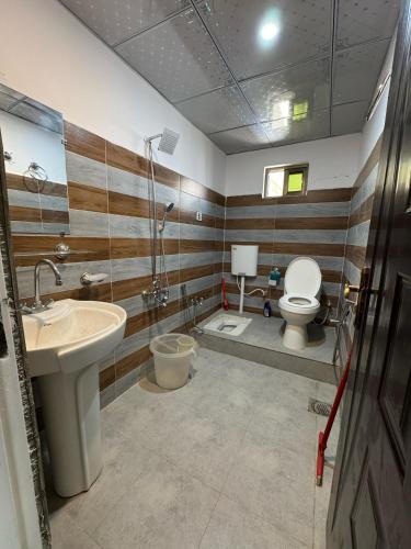 a bathroom with a sink and a toilet at EYE VIEW GUEST HOUSE skardu in Skardu
