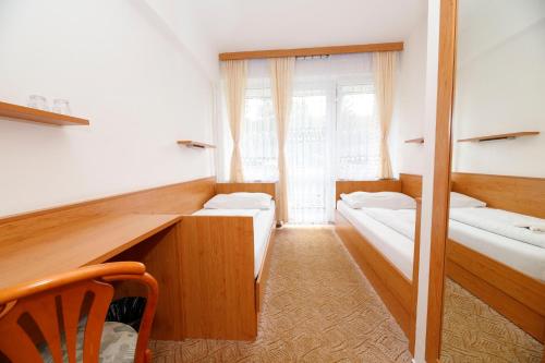 Ένα ή περισσότερα κρεβάτια σε δωμάτιο στο Horský Hotel Neptun