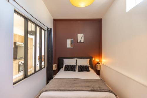 Postel nebo postele na pokoji v ubytování Le Patio - Spacieux T3 avec climatisation et jardin privatif