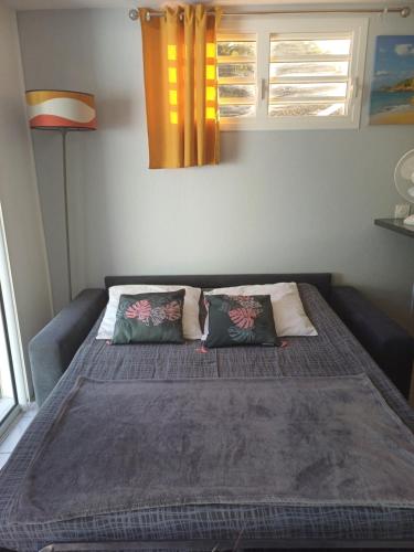 Cama o camas de una habitación en Le Cocon de l'Oranger