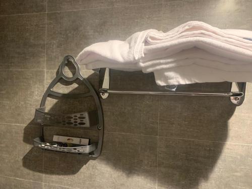 a towelrack in a bathroom with a towel at اعالي للشقق المخدومه in Abha
