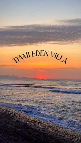 a sunset over the ocean with the words team eden villa at Tiami Eden Villa - Nghỉ Dưỡng Sân Vườn Ven Biển in Vung Tau