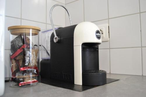 a toaster sitting on top of a kitchen counter at Mansarda in centro - Luxury in Luino