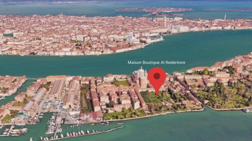 an aerial view of a city with a red marker at Maison Boutique Al Redentore in Venice