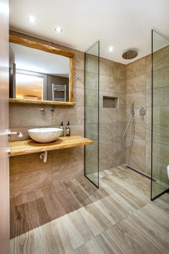 a bathroom with a sink and a shower at Theros Easy Living in Theológos