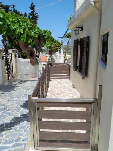 a wooden stairway leading up to a building at Michaela's House in Tsikalariá