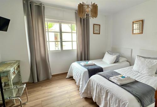 Una cama o camas en una habitación de Mar De Frisia