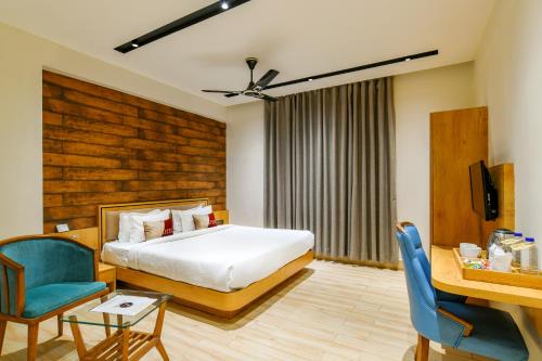 Ένα ή περισσότερα κρεβάτια σε δωμάτιο στο Aceotel Premier TK, Morbi