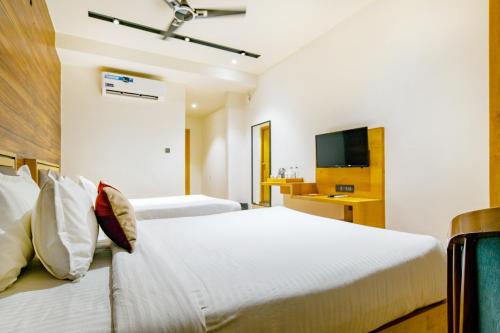 Ένα ή περισσότερα κρεβάτια σε δωμάτιο στο Aceotel Premier TK, Morbi