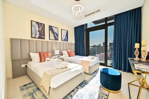 a hotel room with two beds and a desk at New Luxury 2 Bedroom with Burj Khalifa View & Spectacular Rooftop Infinity Pool Bar in Dubai