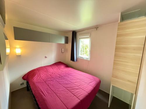 Ένα ή περισσότερα κρεβάτια σε δωμάτιο στο Camping Le Clocher de Neyran