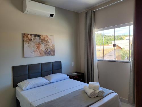 Postel nebo postele na pokoji v ubytování Flats Ipê