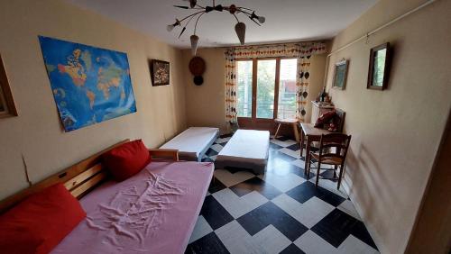 a living room with a couch and a table at Maison de village in Corbonod