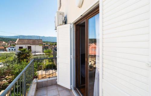 a balcony with a view of a city at One-Bedroom Apartment In Vrboska in Vrboska