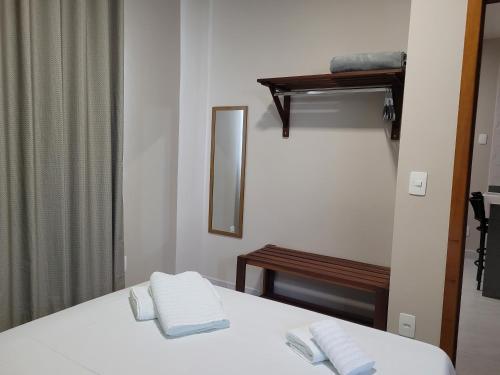 Ένα ή περισσότερα κρεβάτια σε δωμάτιο στο Flats Ipê
