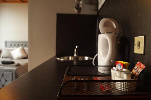 a kitchen with a counter top with a coffee maker at The Shepherds Rest in Halifax