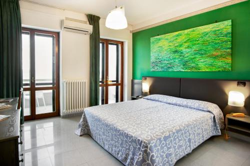 Postel nebo postele na pokoji v ubytování Hotel Côte D'Est