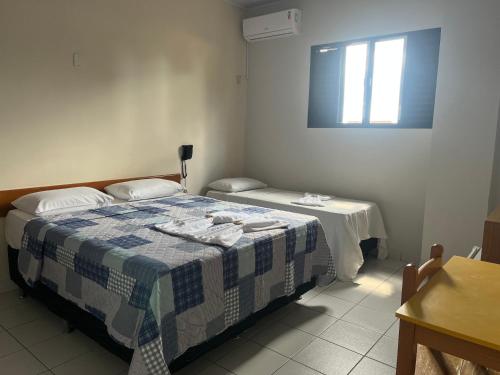 Postel nebo postele na pokoji v ubytování Hotel Águia