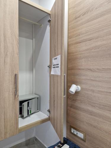 a small bathroom with a mirror and a sink at Christina Studios in Kefalos