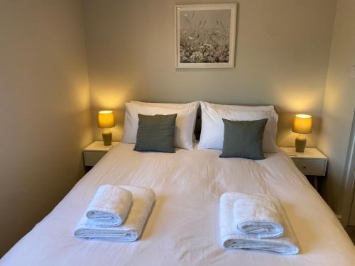 Ένα ή περισσότερα κρεβάτια σε δωμάτιο στο Jasmine Cottage