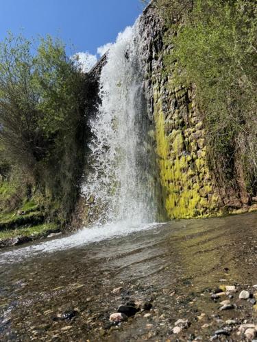 a waterfall on the side of a river at Voyage House in the countryside Polen in Korçë