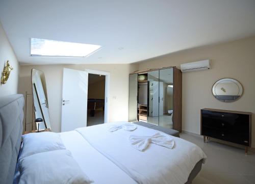 Ένα ή περισσότερα κρεβάτια σε δωμάτιο στο BlueHomes Villas