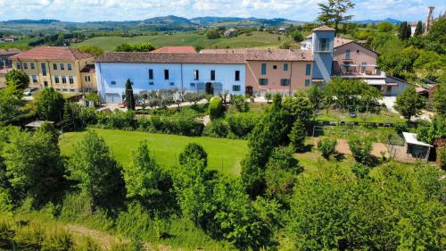 an aerial view of a village with houses and trees at Agriturismo Le Tre Rose - Cantina Zanello in Rosignano Monferrato
