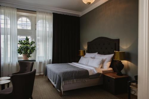 Postel nebo postele na pokoji v ubytování Home Hotel Christian IV