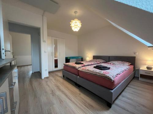 a bedroom with a large bed in a room at Ferienwohnung Sonnenschein Gartenblick in Uelzen