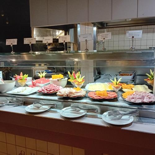 a buffet line with many different types of food at Hotel Monopol in Puerto de la Cruz