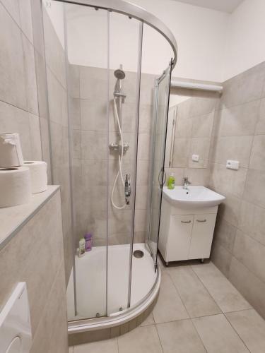 a bathroom with a shower and a toilet and a sink at Star Apartments Brno #3C315 by Starbnb EU in Brno