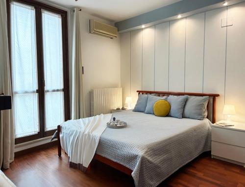 Ένα ή περισσότερα κρεβάτια σε δωμάτιο στο Holihome - Le Magnolie