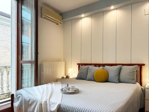 Ένα ή περισσότερα κρεβάτια σε δωμάτιο στο Holihome - Le Magnolie