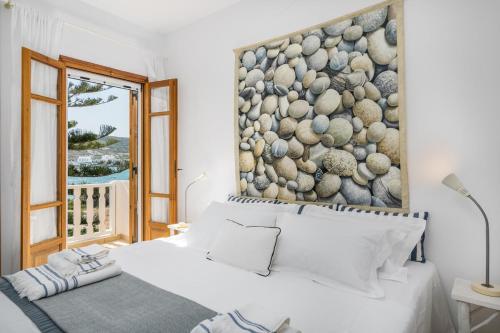 Postel nebo postele na pokoji v ubytování Arokaria Seafront Home