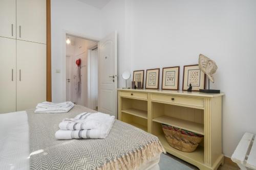 Postel nebo postele na pokoji v ubytování Arokaria Seafront Home