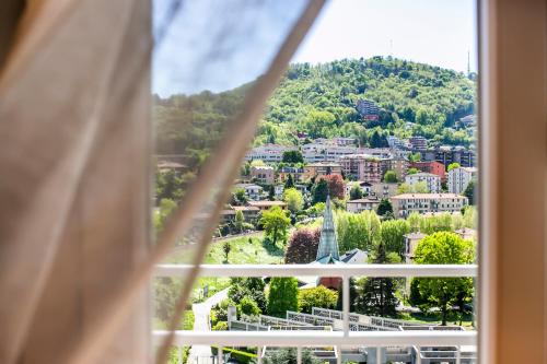 a view of a city from a window at 10FLOOR Private Parking in Como
