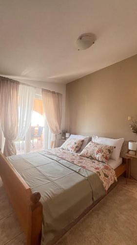 a bedroom with a large bed and a window at Mint Bellavista in Vir