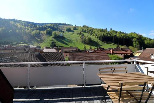 a balcony with two chairs and a view of a mountain at Apartment "Blackforest", Todtnau, 5 Schlafzimmer in Todtnau
