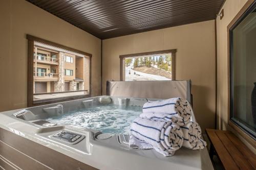 a bath tub with a towel sitting in it at Beaverhead Condo - 5 Slalom #301 in Big Sky