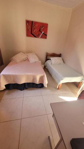 Ένα ή περισσότερα κρεβάτια σε δωμάτιο στο Pousada Castilho