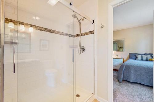 a shower with a glass door in a bedroom at Town of Bethany Beach --- 417 Lekites Ave in Bethany Beach