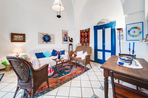 a living room with a couch and a table at Casa Fiammetta in Leuca